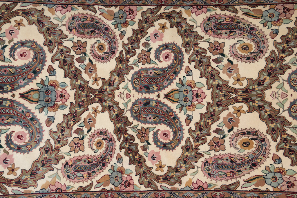 Close-up of a patterned rug with intricate designs and colors.