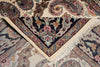 Load image into Gallery viewer, Close-up of a patterned rug with intricate designs and fringes.