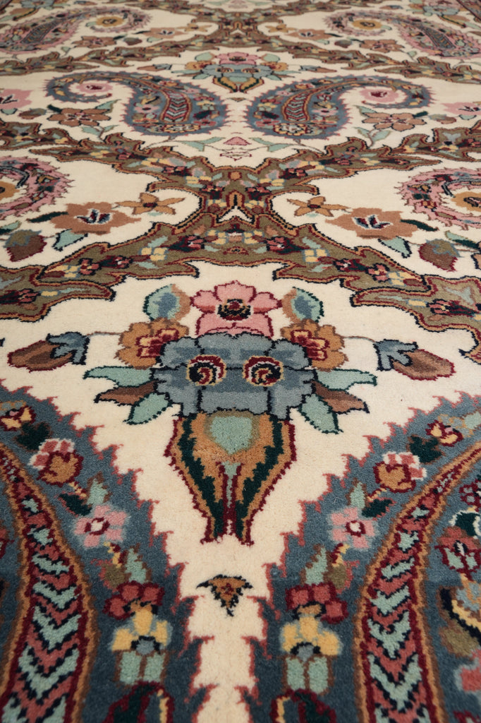 Close-up of a patterned rug with intricate designs and colors.