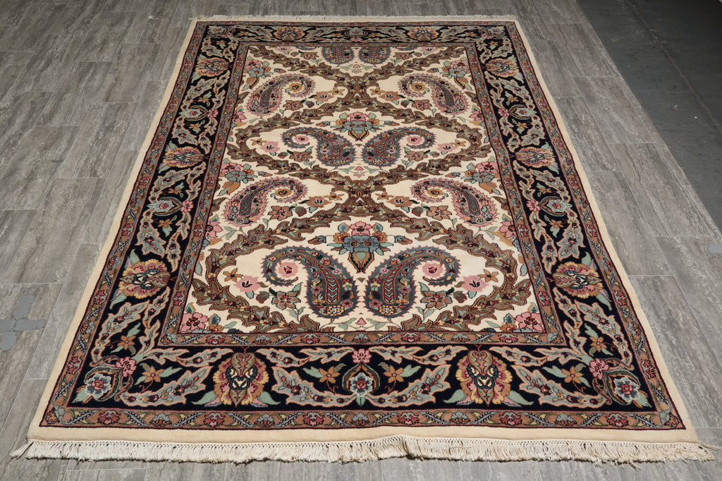 Decorative rug with intricate patterns on a wooden floor