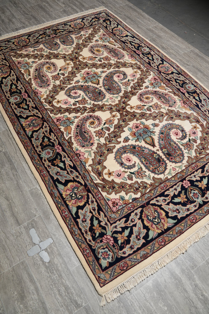 Decorative rug with intricate patterns on a wooden floor