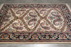 Load image into Gallery viewer, Decorative rug with intricate paisley pattern on a wooden floor