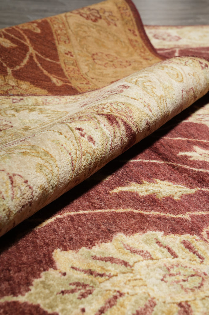 Close-up of patterned rugs with intricate designs on a neutral background