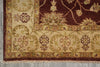 Load image into Gallery viewer, Close-up of an ornate rug with intricate patterns on a gray floor.