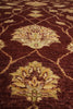 Load image into Gallery viewer, Close-up of a patterned rug with intricate designs on a brown background