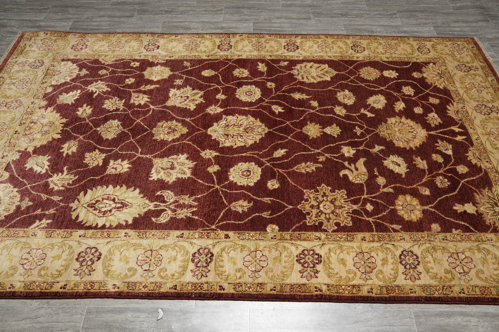 Decorative rug with intricate patterns on a wooden floor