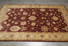 Load image into Gallery viewer, Decorative rug with intricate patterns on a wooden floor