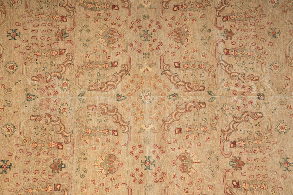 Close-up of a patterned fabric with intricate designs on a beige background