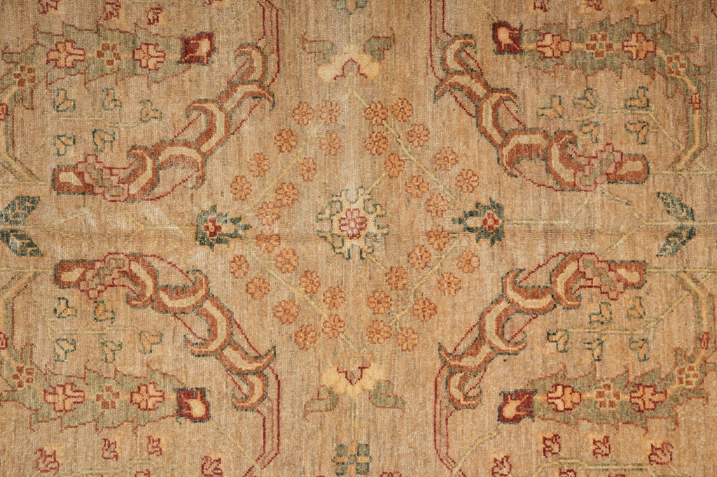 Close-up of an intricately patterned rug with floral and geometric designs.