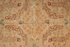 Load image into Gallery viewer, Close-up of an intricately patterned rug with floral and geometric designs.