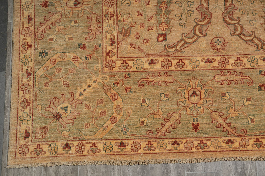 Close-up of an intricately designed rug with geometric patterns on a gray floor.