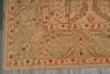 Load image into Gallery viewer, Close-up of an intricately designed rug with geometric patterns on a gray floor.