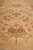 Load image into Gallery viewer, Close-up of a patterned rug with floral and geometric designs.