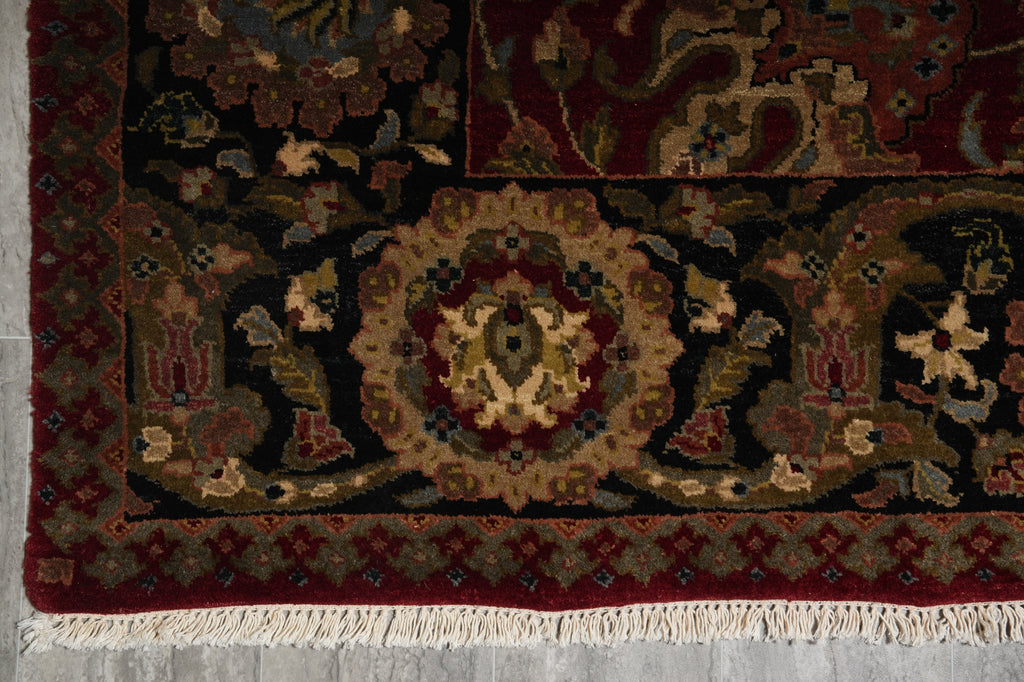 Decorative rug with intricate patterns on a concrete floor