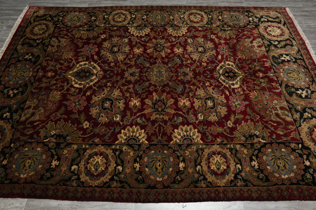 Decorative rug with intricate patterns on a wooden floor
