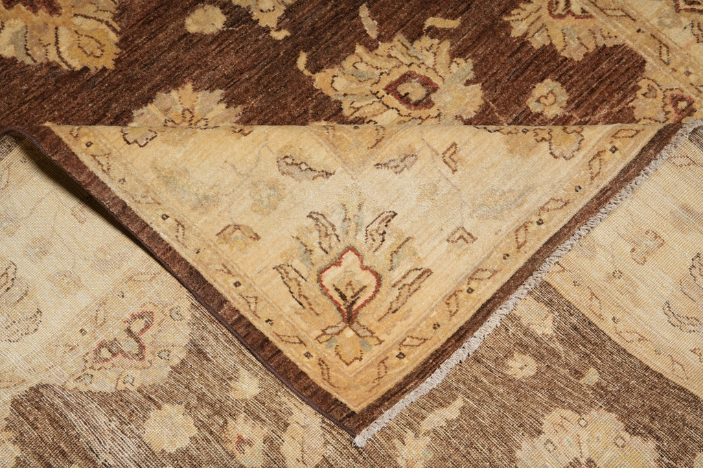 Close-up of a patterned rug with brown and beige colors