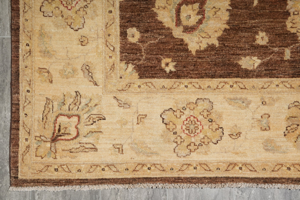 Close-up of a patterned rug with floral designs on a neutral background