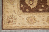 Load image into Gallery viewer, Close-up of a patterned rug with floral designs on a neutral background