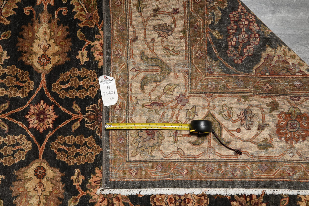 Decorative rug with a measuring tape on top, showing dimensions.