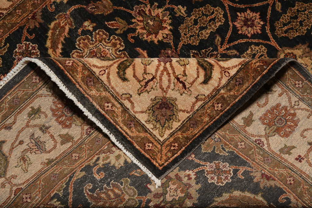 Close-up of an intricately patterned rug with a focus on the corner.