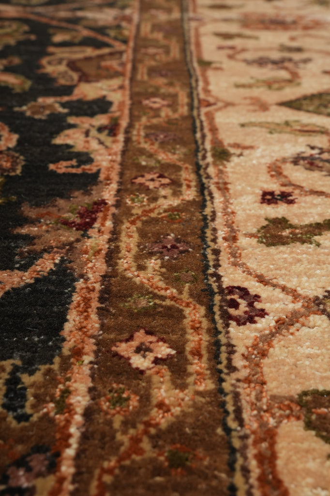 Close-up of a patterned rug with intricate designs.