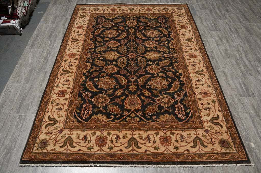 Decorative rug with intricate patterns on a wooden floor