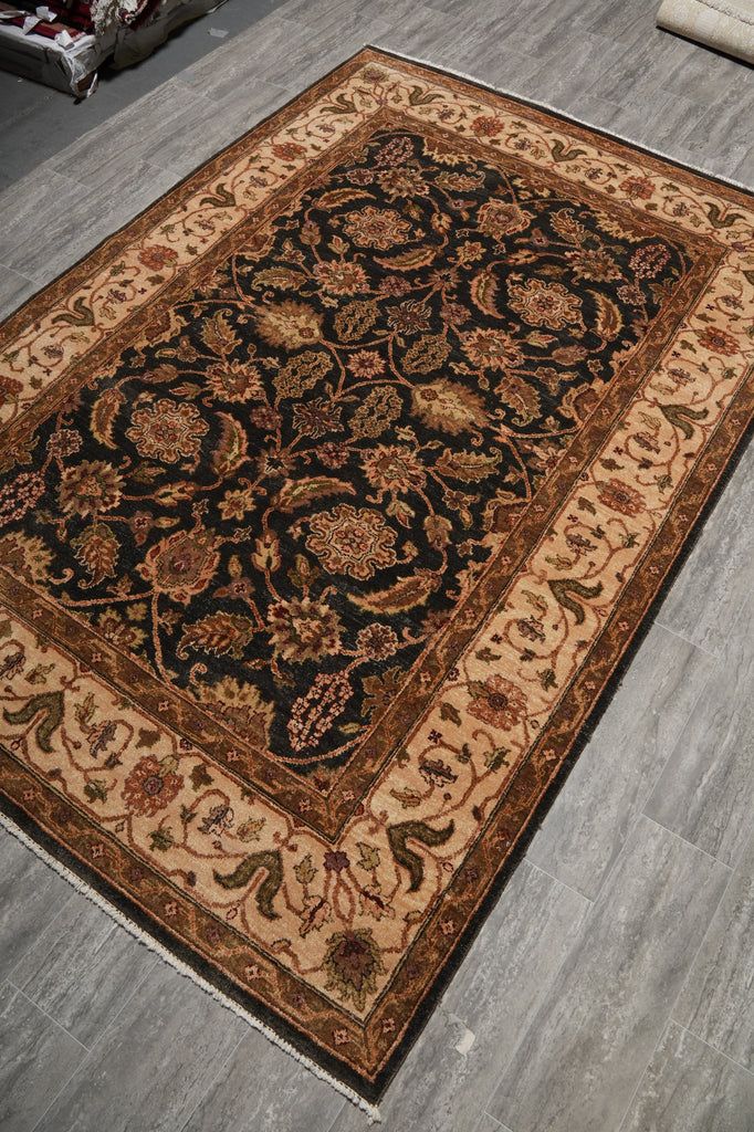 Decorative rug with intricate patterns on a wooden floor