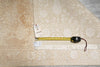 Load image into Gallery viewer, Beige patterned rug with a measuring tape and label on top