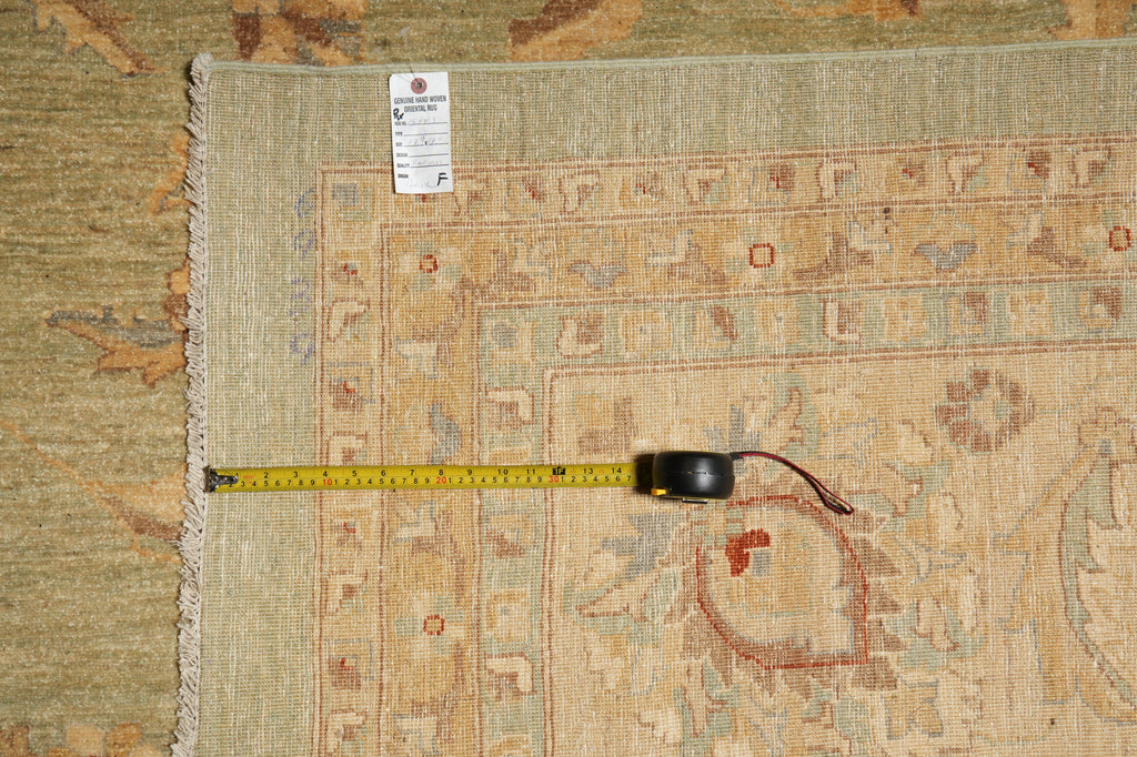 Rug with a measuring tape on top, showing dimensions.