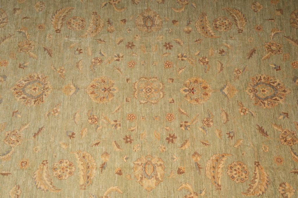 Patterned fabric with floral and paisley designs on a green background