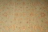 Load image into Gallery viewer, Patterned fabric with floral and paisley designs on a green background