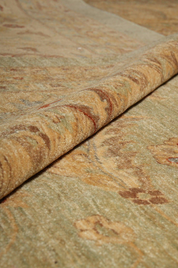 Close-up of a textured stone surface with brown and beige colors