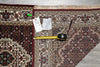 Load image into Gallery viewer, Decorative rug with a measuring tape and price tag on a gray surface