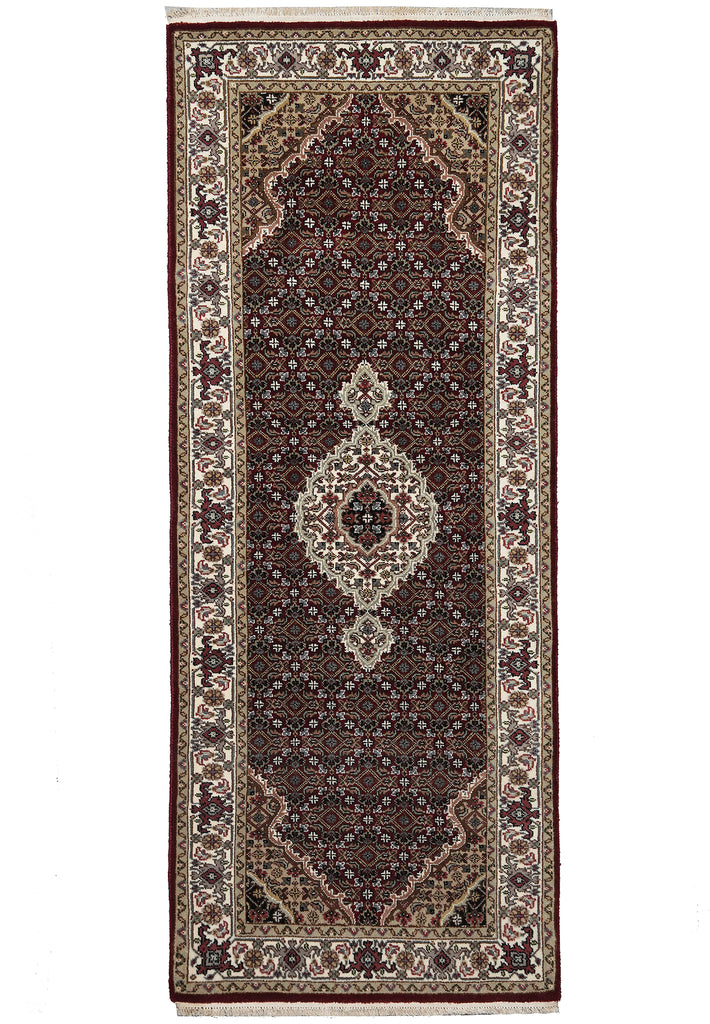 Decorative rug with intricate patterns on a white background