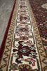 Load image into Gallery viewer, Close-up of a patterned rug with intricate designs.