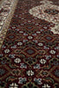 Load image into Gallery viewer, Close-up of a patterned rug with intricate designs.