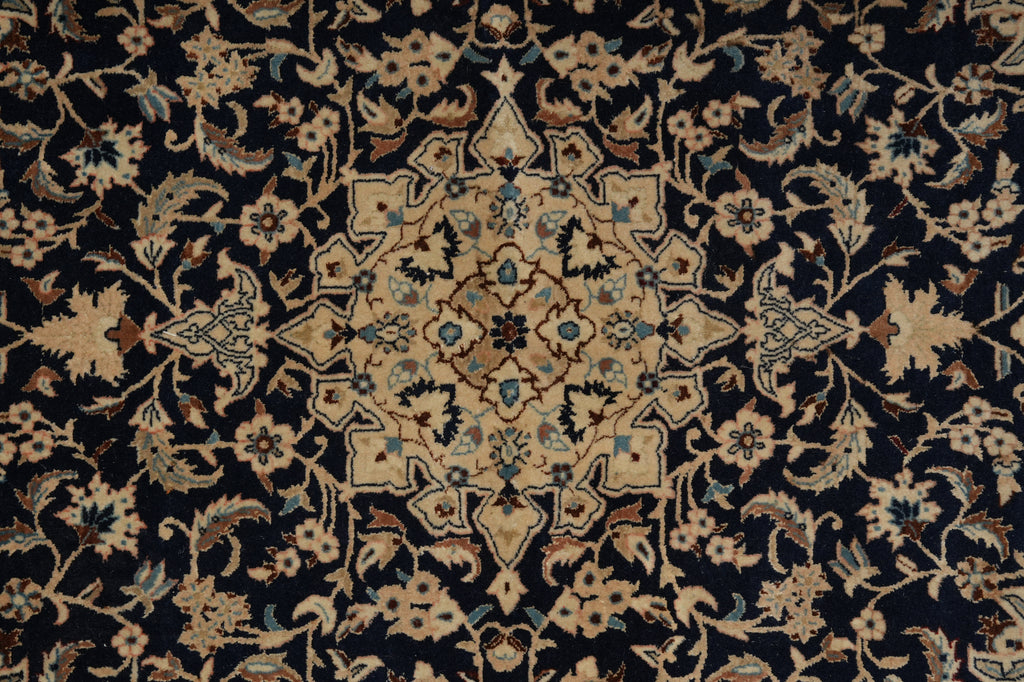 Close-up of a patterned rug with intricate designs.