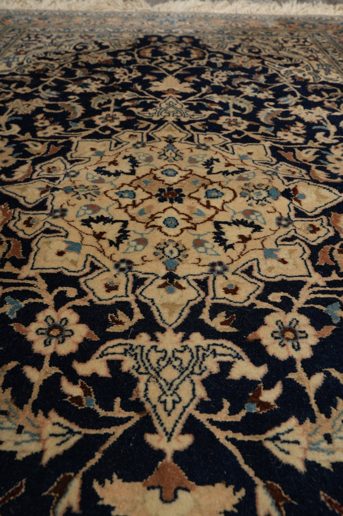 Close-up of a patterned rug with intricate designs.