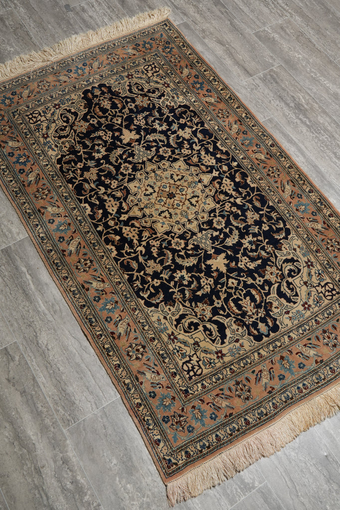 Decorative rug with intricate patterns on a gray floor