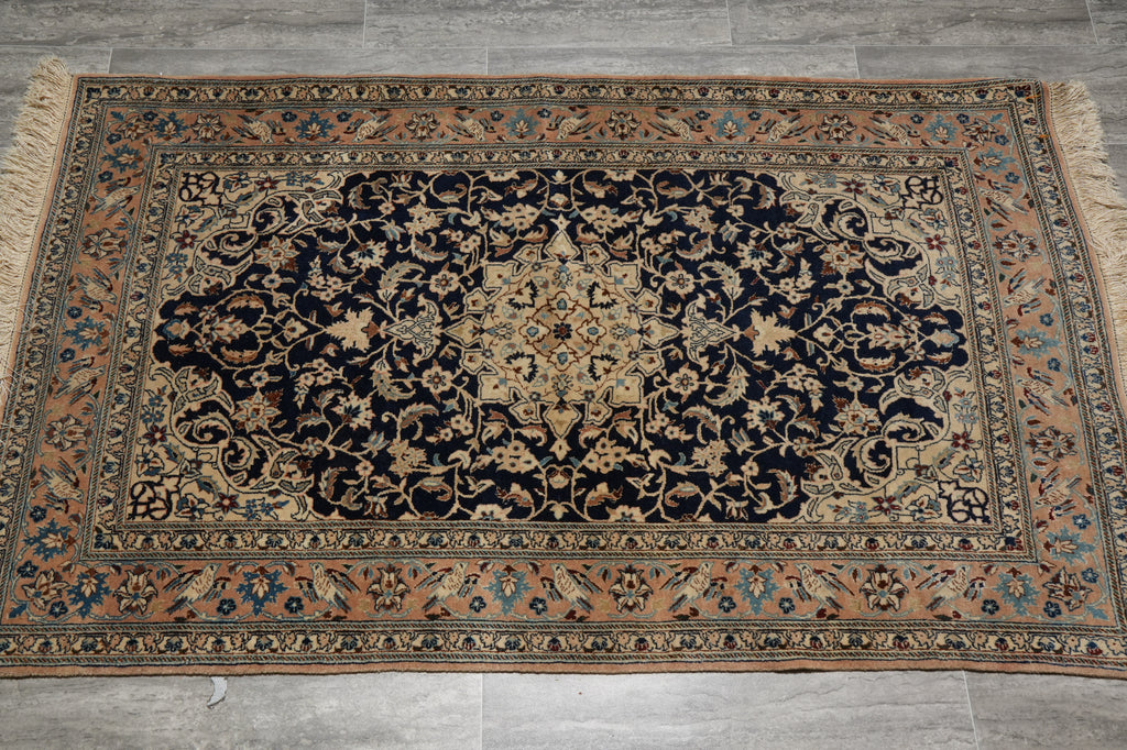 Decorative rug with intricate patterns on a wooden floor