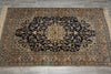 Load image into Gallery viewer, Decorative rug with intricate patterns on a wooden floor