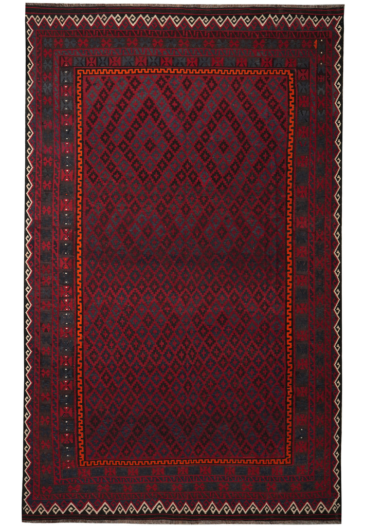 Red and black patterned rug with geometric design