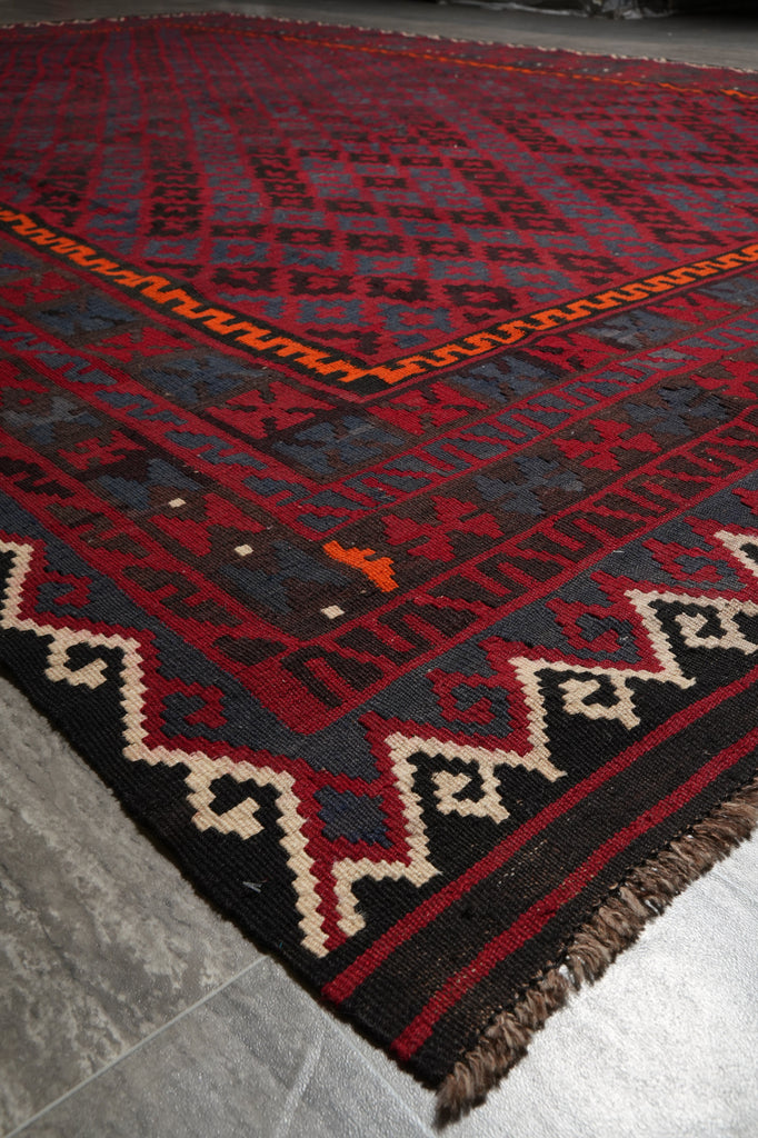 Traditional patterned rug on a stone floor