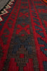 Load image into Gallery viewer, Close-up of a patterned rug with red and brown colors