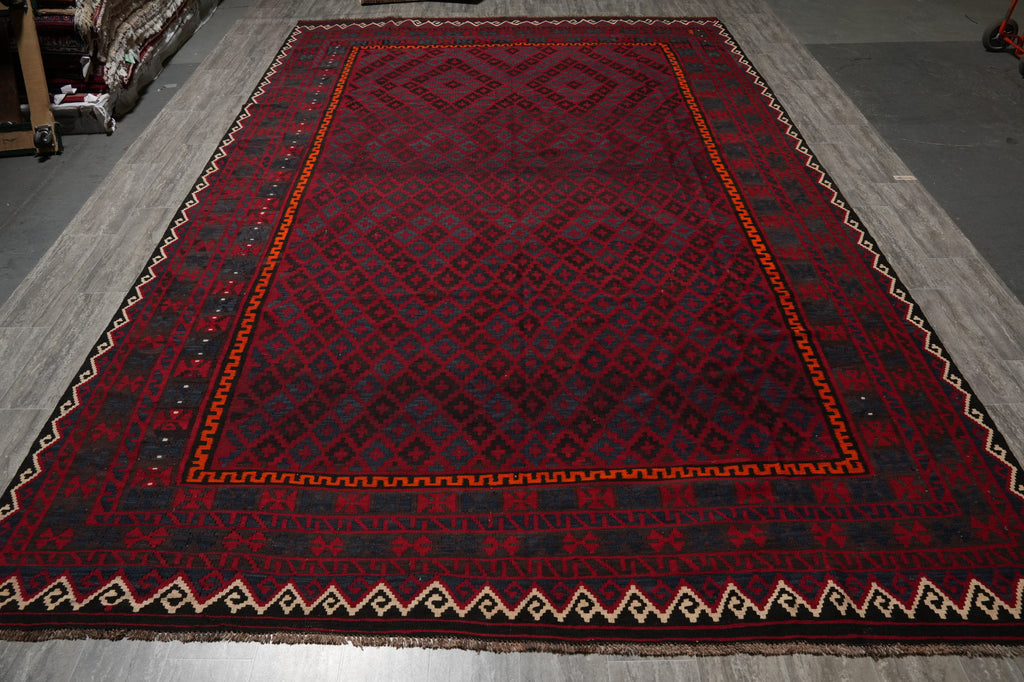Red patterned rug on a gray floor