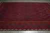Load image into Gallery viewer, Red and black patterned rug on a wooden floor