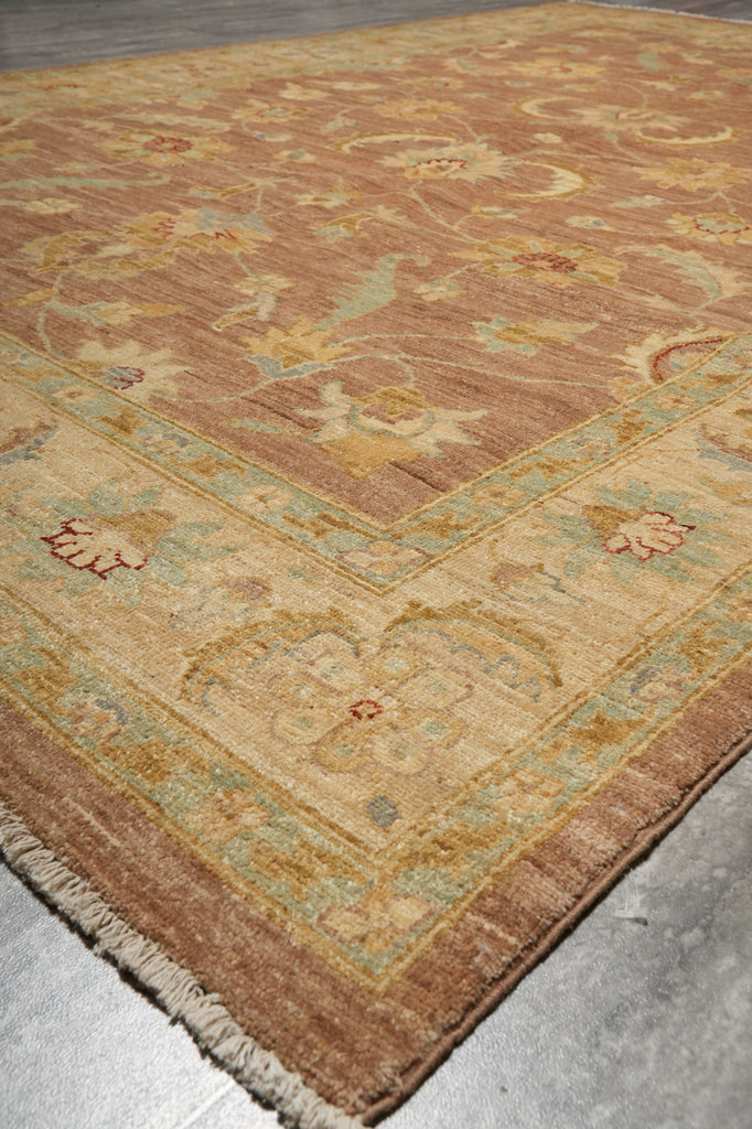 Close-up of a patterned rug on a concrete floor