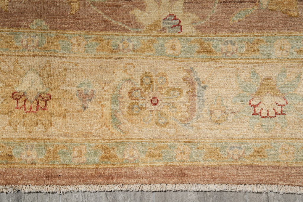Close-up of a patterned rug with intricate designs on a wooden floor.