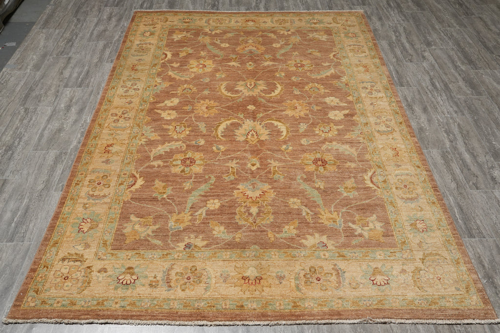 Decorative rug with intricate patterns on a wooden floor