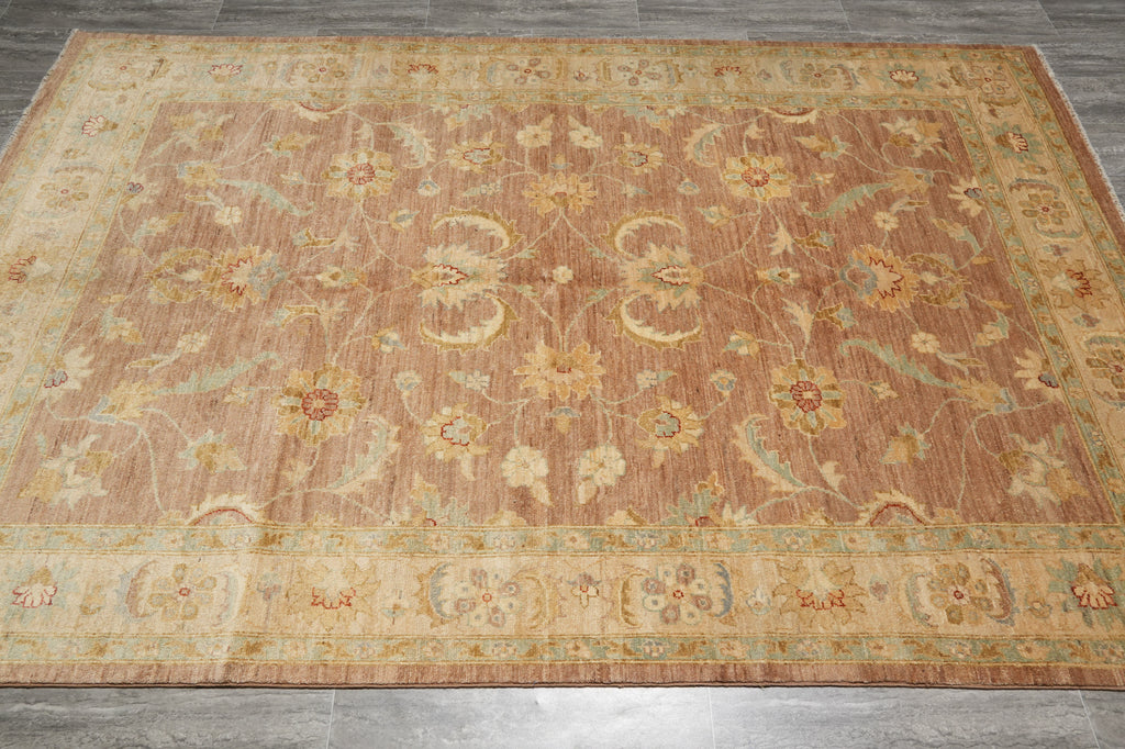 Decorative rug with floral patterns on a wooden floor